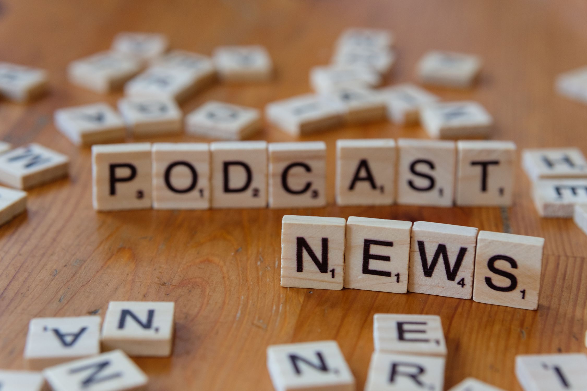 Podcast Tile Podcast News Concept with Wooden Letter Tiles · Free Stock Photo