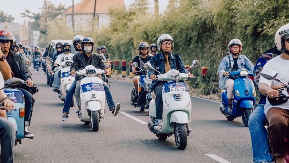 Tourists renting a scooter on a street in Bali, Indonesia