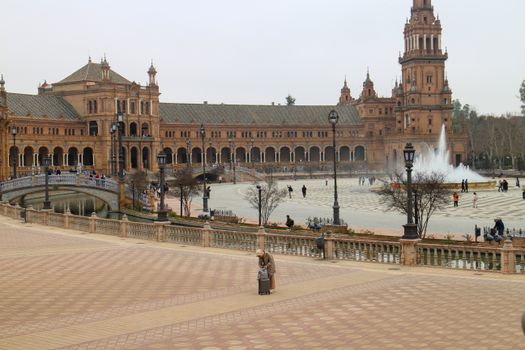 Captivating view of Plaza de España, Seville with iconic architecture and fountain.