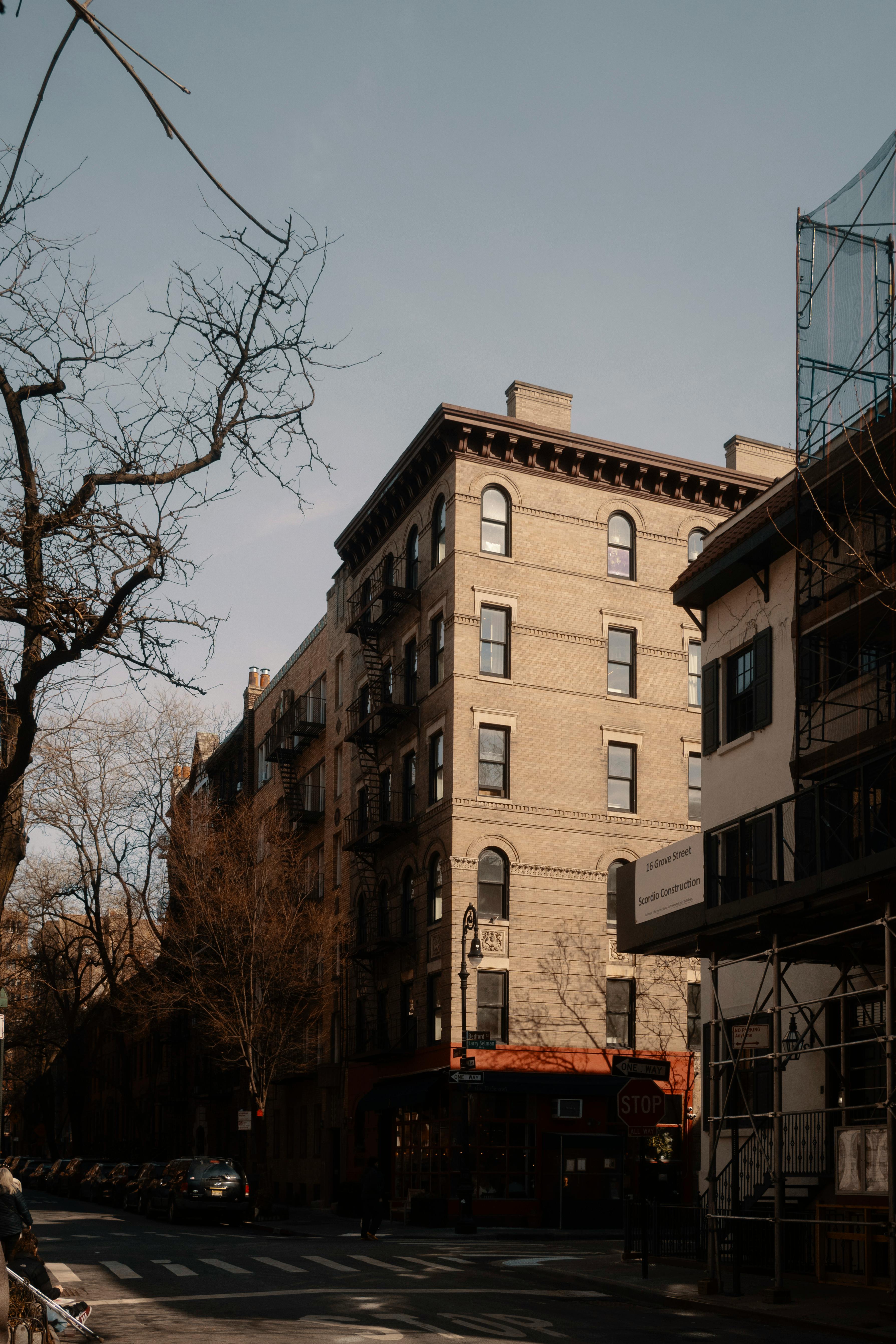 Free Charming urban street with traditional brick buildings under a clear sky. Stock Photo