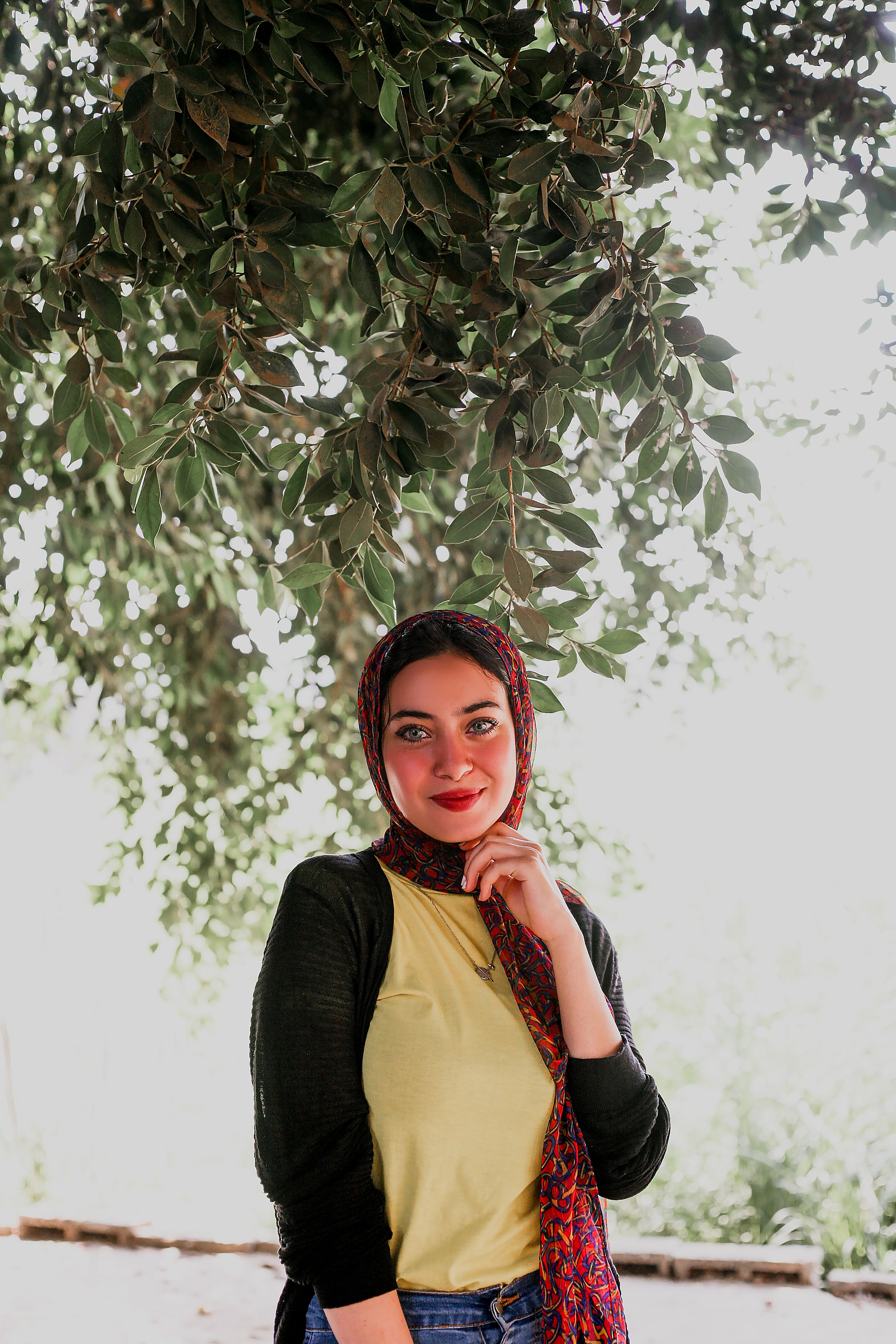 Woman Standing Near Leaves