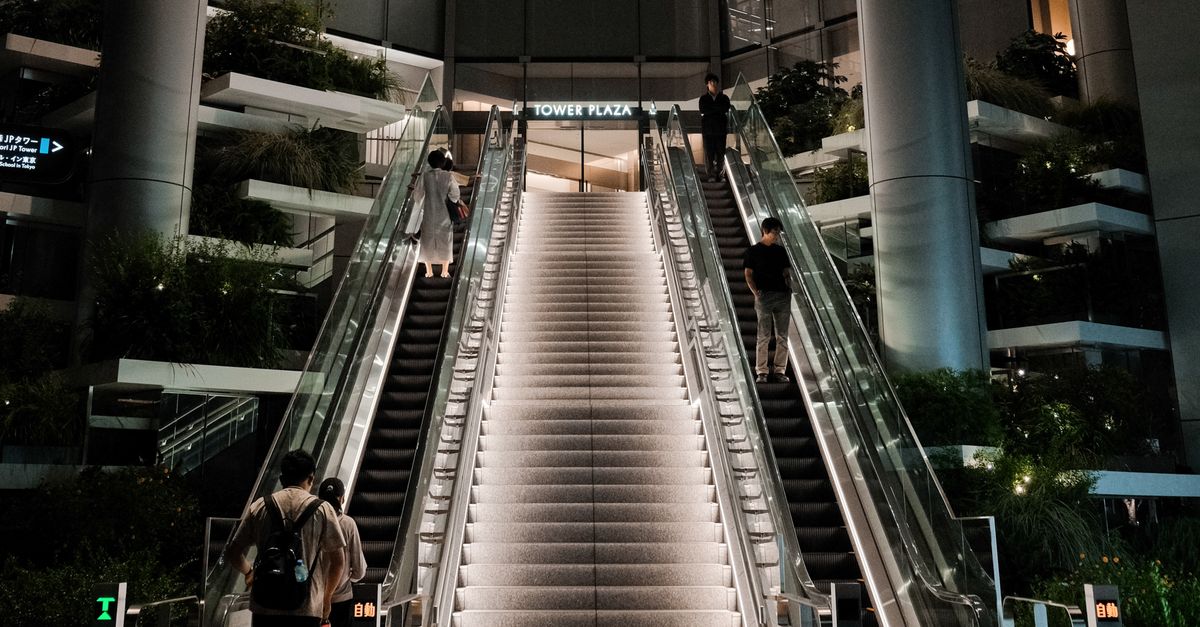 Modern Escalator in Urban High-rise Plaza · Free Stock Photo