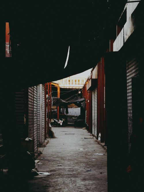 Free Moody view of a narrow alley in Agadir's market, capturing the essence of Moroccan street life. Stock Photo