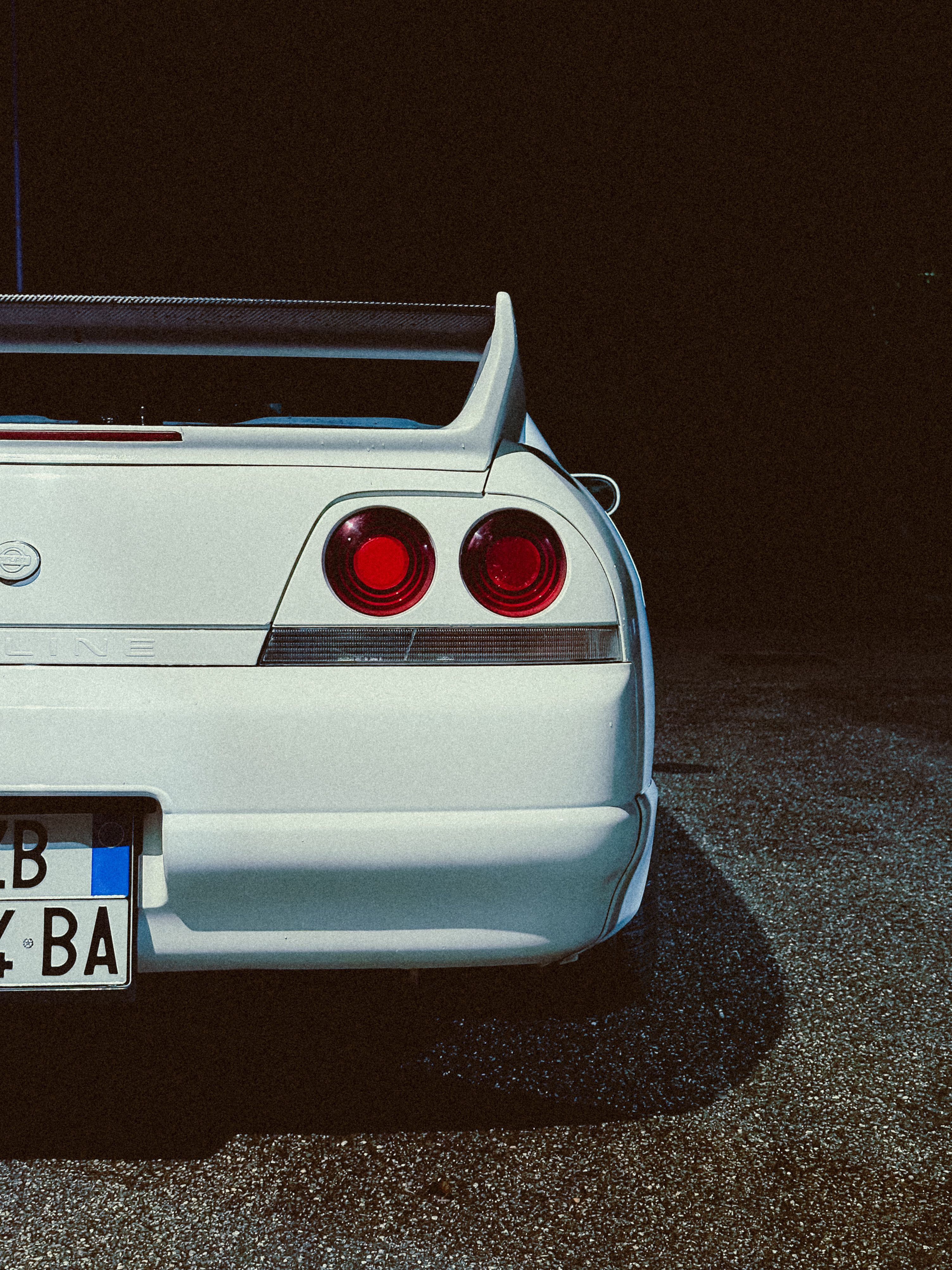 Classic White Sports Car Rear View at Night · Free Stock Photo