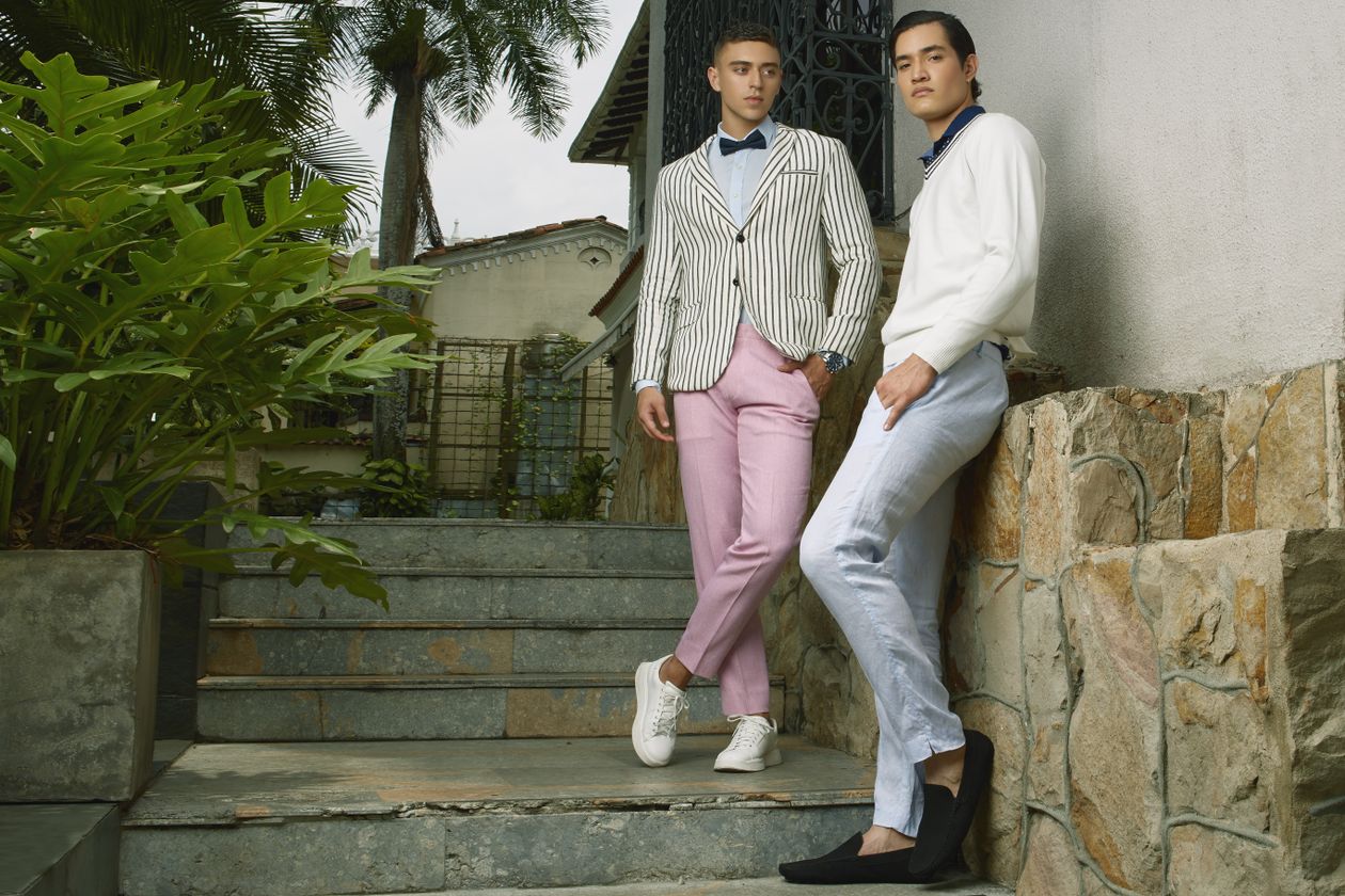 Stylish young men posing in fashionable outdoor attire, showcasing body-type-appropriate clothing