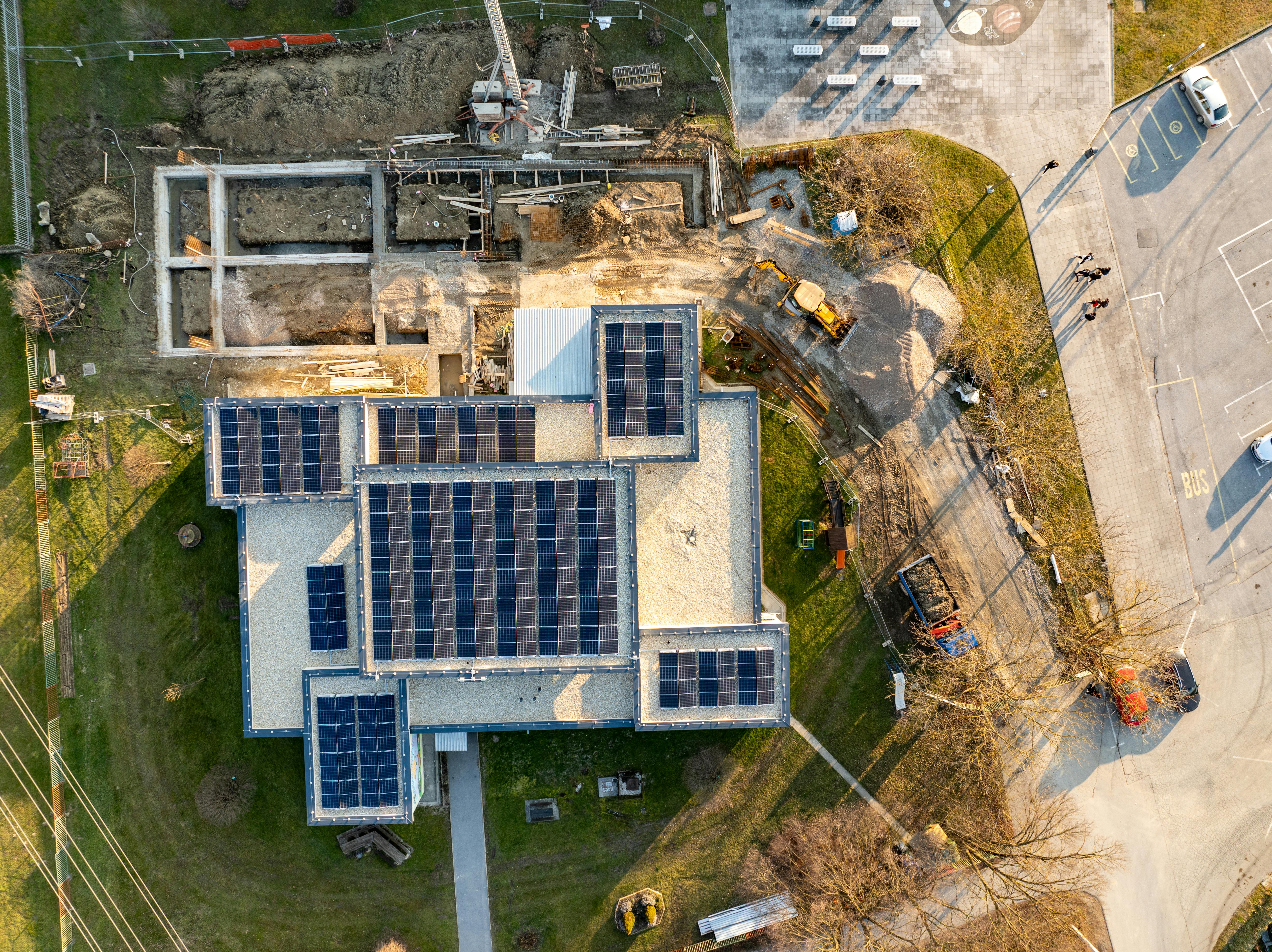 drone surveying a renewable energy construction site - renewable energy construction