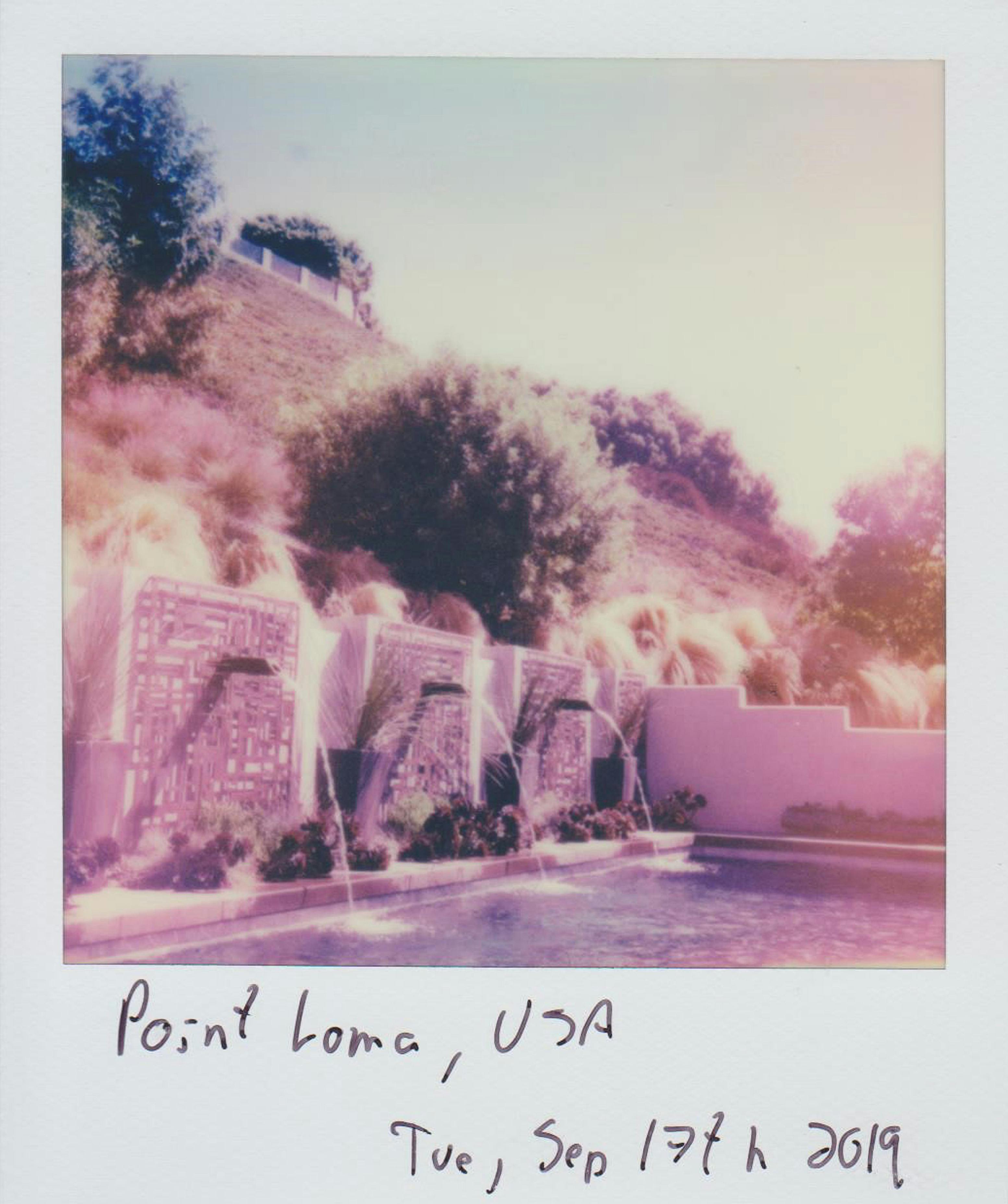Retro-style instant photo capturing a serene poolside landscape at Point Loma.