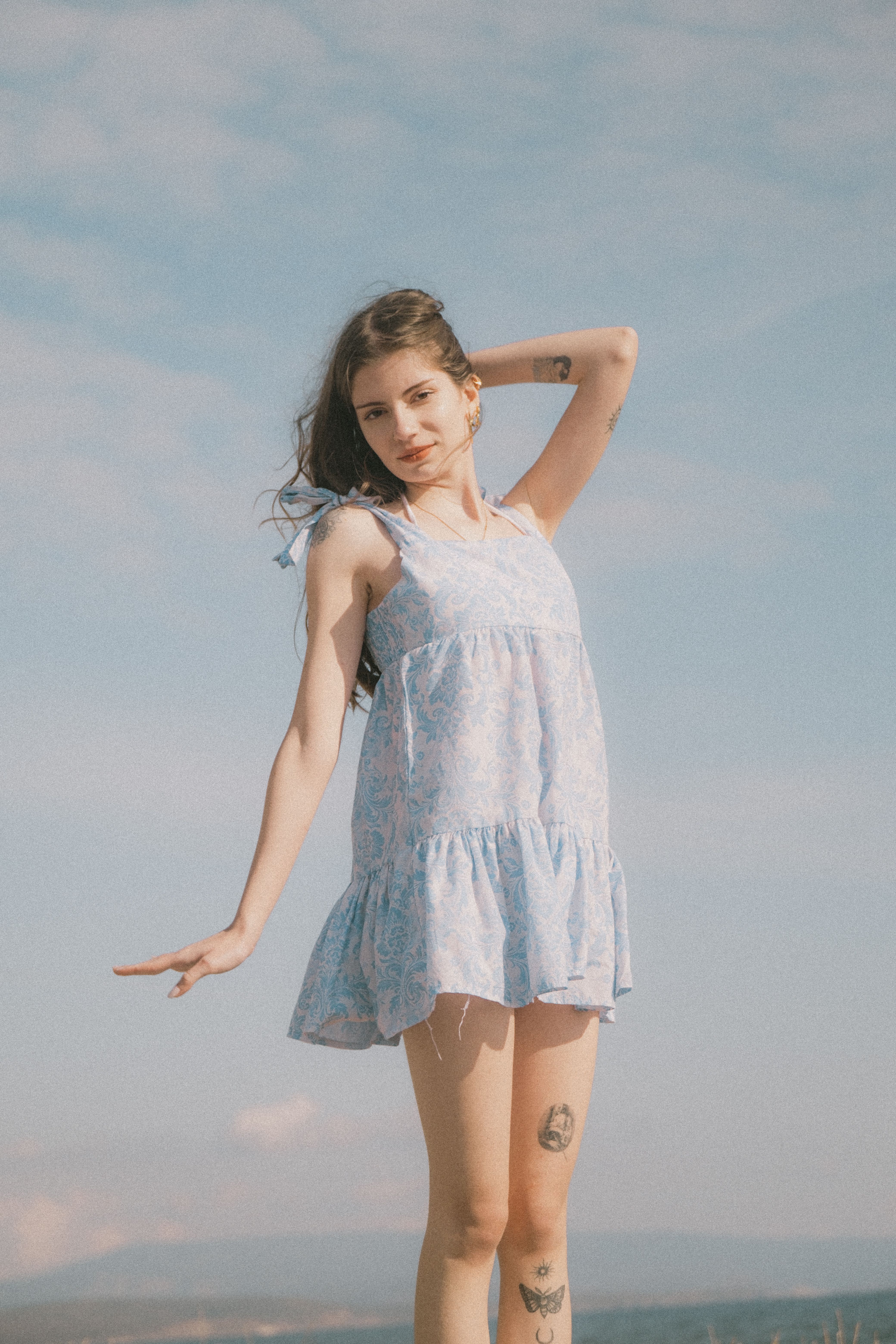 Woman in floral sundress at a daytime party