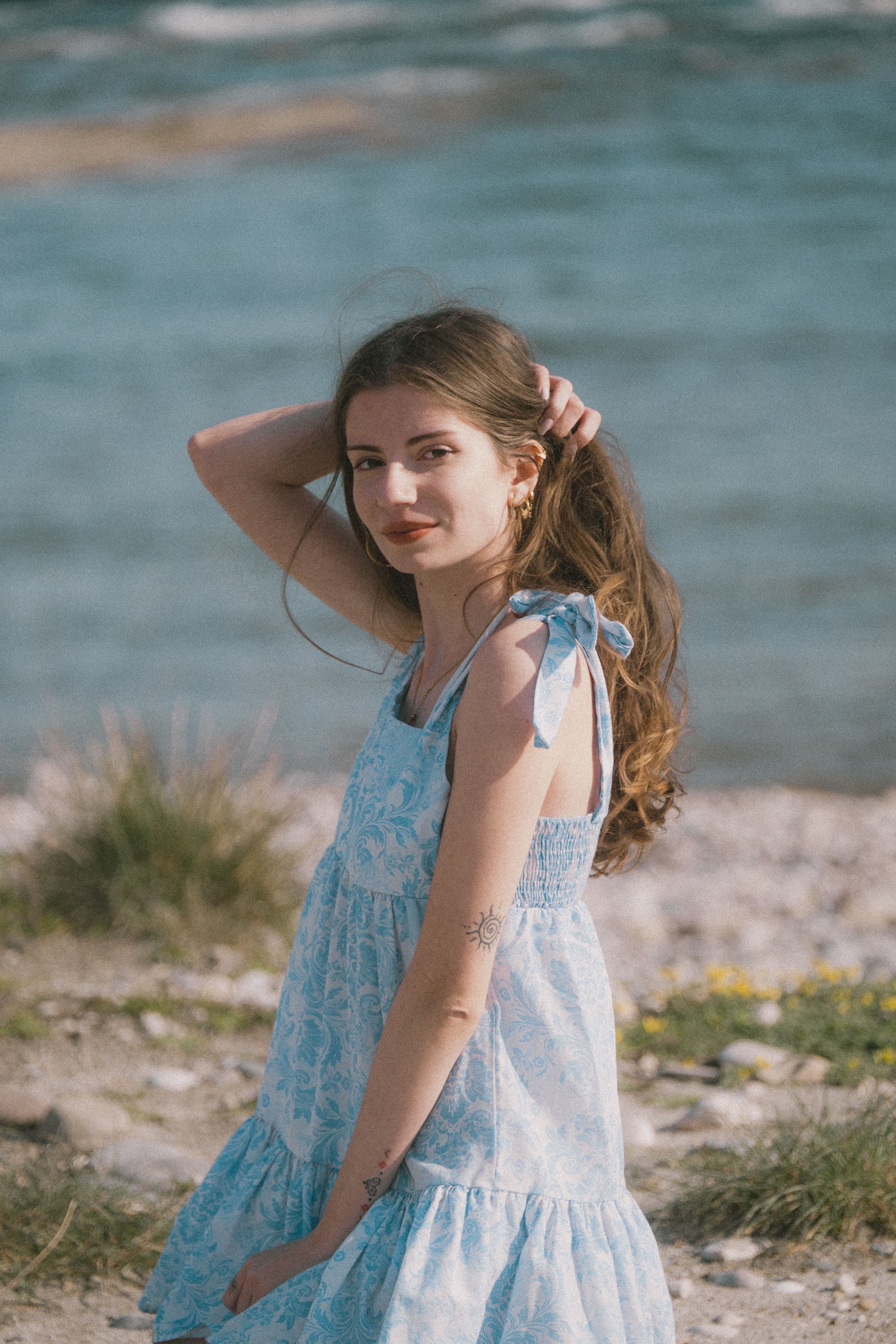 Young Woman in Blue Dress by the Sea · Free Stock Photo