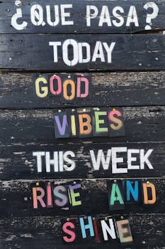 Rustic wooden sign displaying motivational phrases to inspire positivity.
