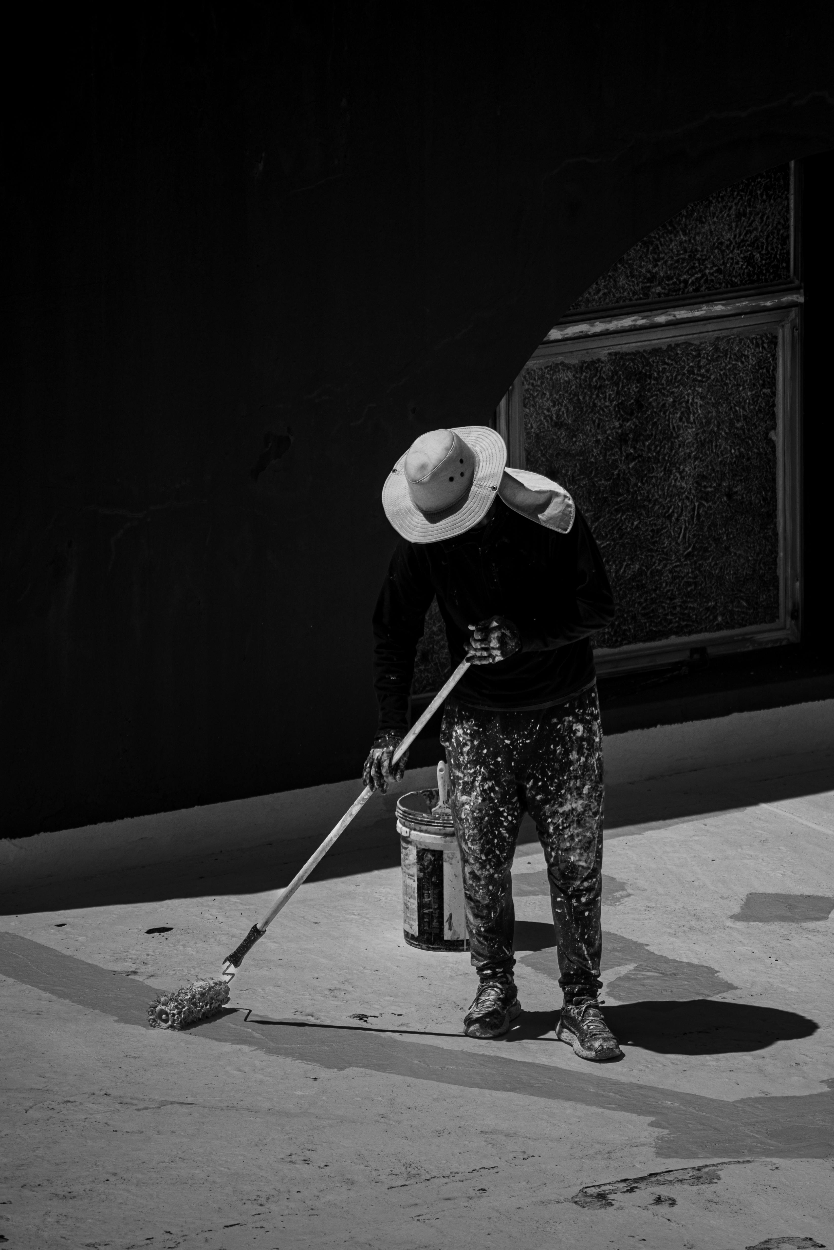 monochromatic image of a painter at work