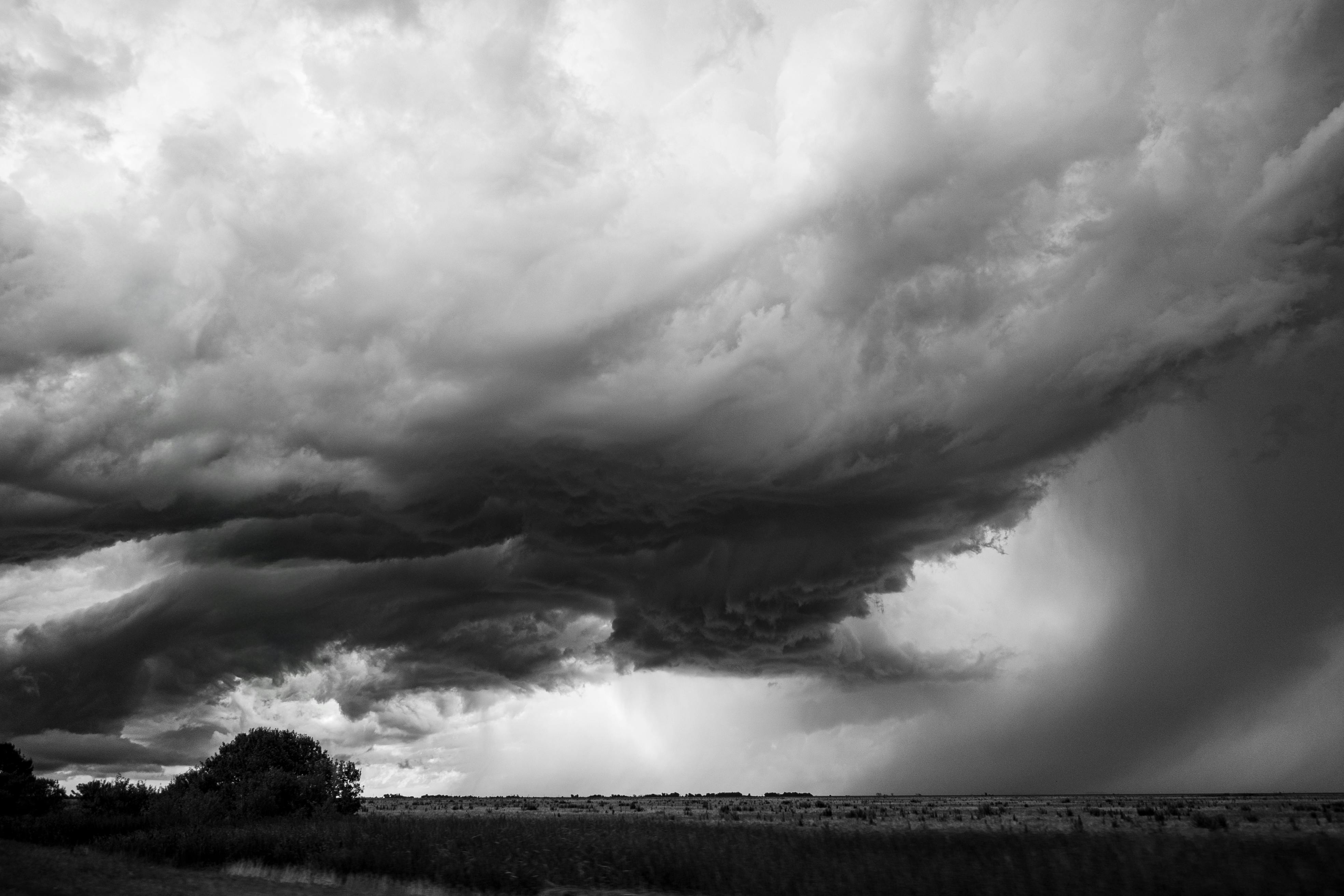 Black and white photo of towering storm clouds over Mar del Plata, Argentina.