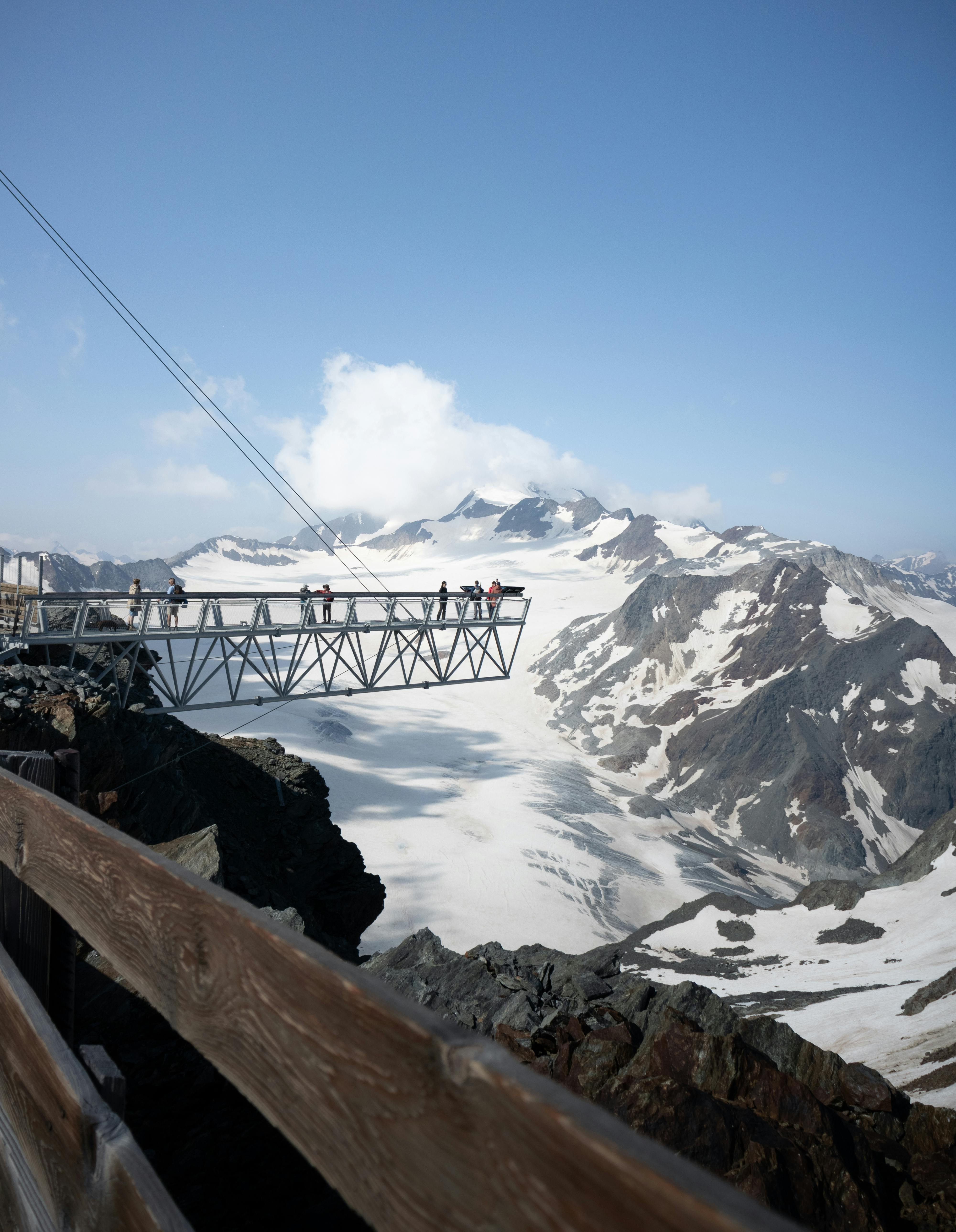 Stunning alpine view of snowy peaks and skywalk at Sölden, Austria.