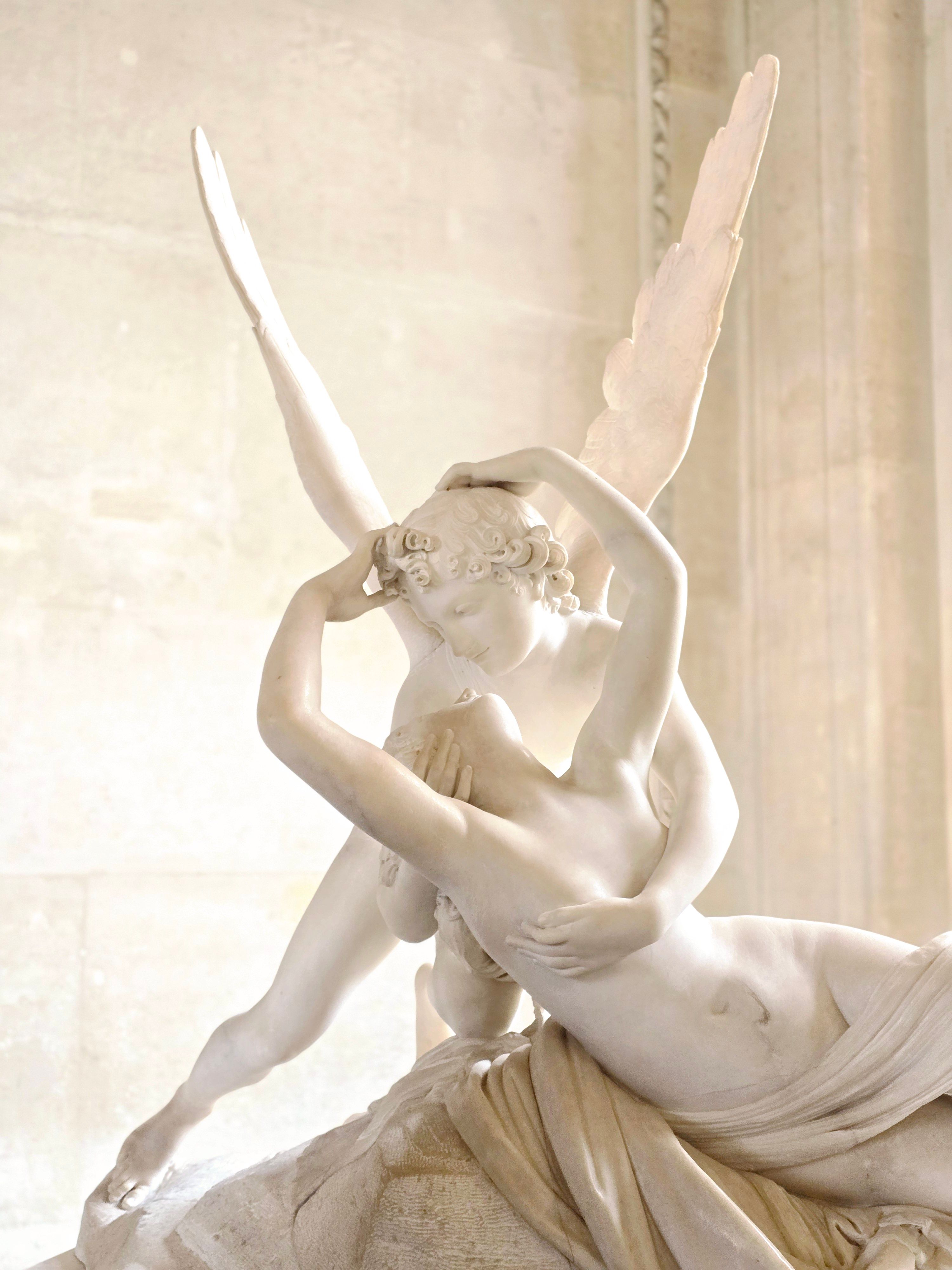 Elegant marble sculpture depicting Greek mythology, Cupid and Psyche.