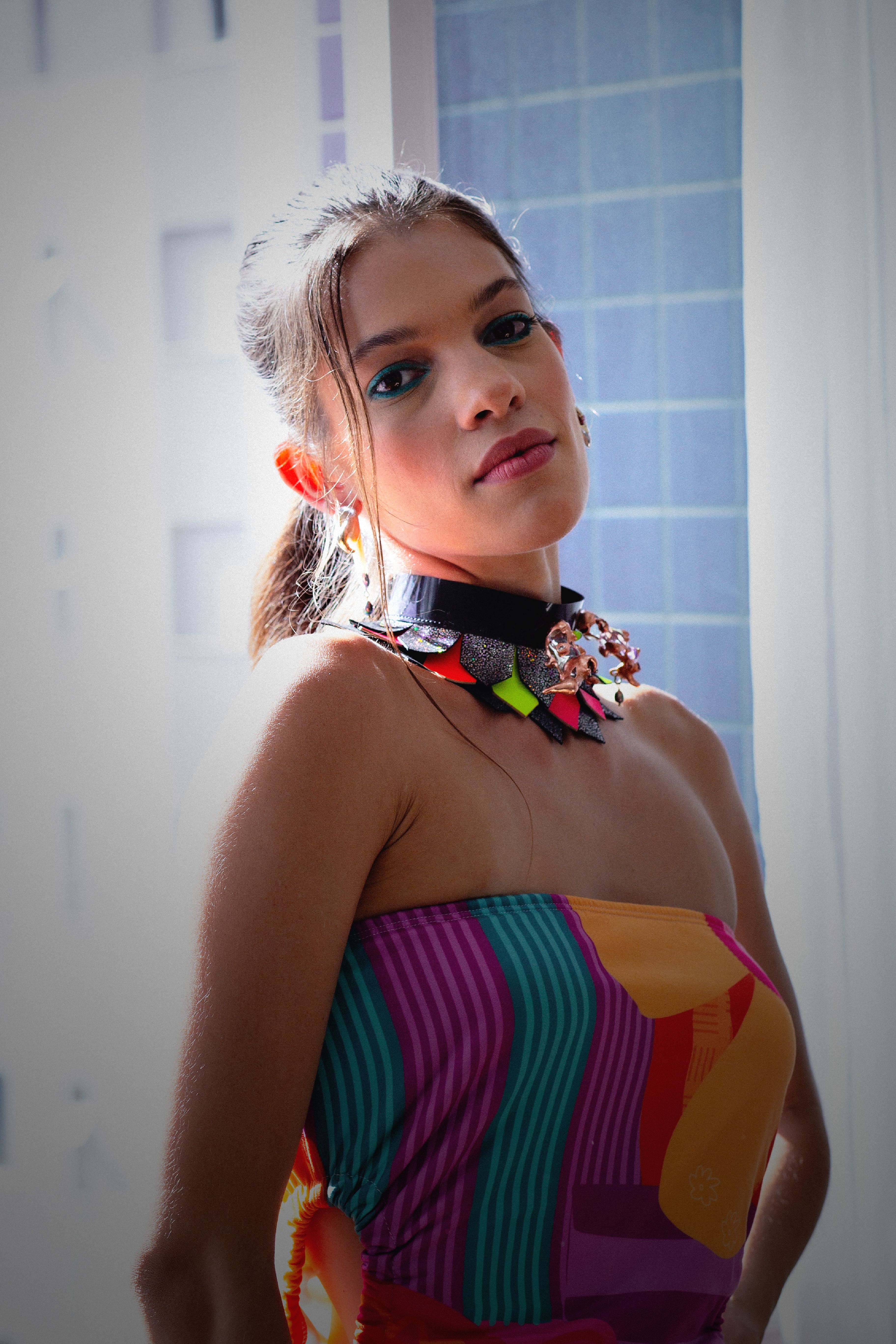 Vibrant Portrait of Woman in Colorful Dress · Free Stock Photo
