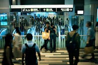 Busy Shinjuku Station in Tokyo with Commuters