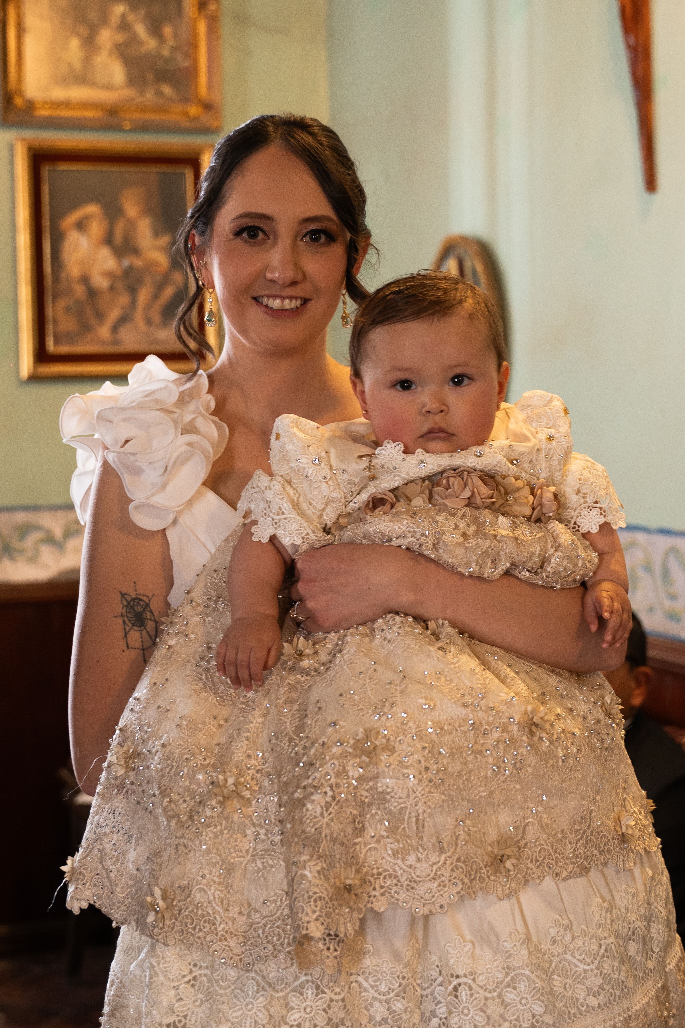Elegant Mother and Baby in Formal Attire Indoors  Free Stock Photo