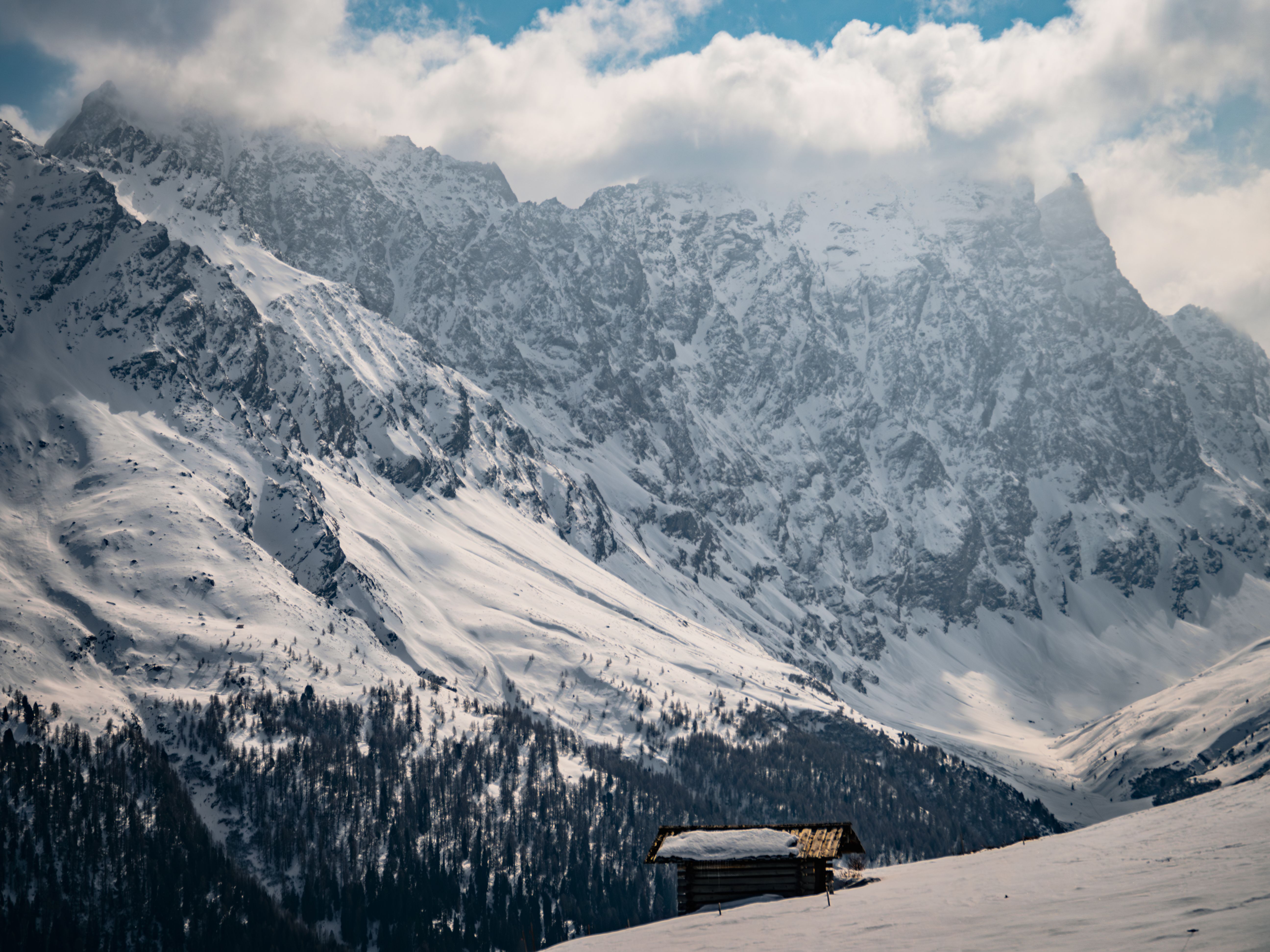 Serene Winter Cabin in Swiss Alps · Free Stock Photo
