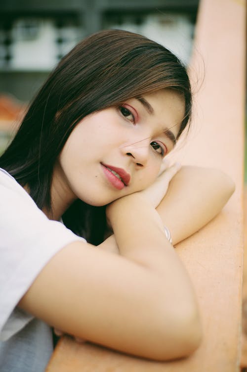 Young Woman in White T-shirt With Eye Shadow and Lipstick