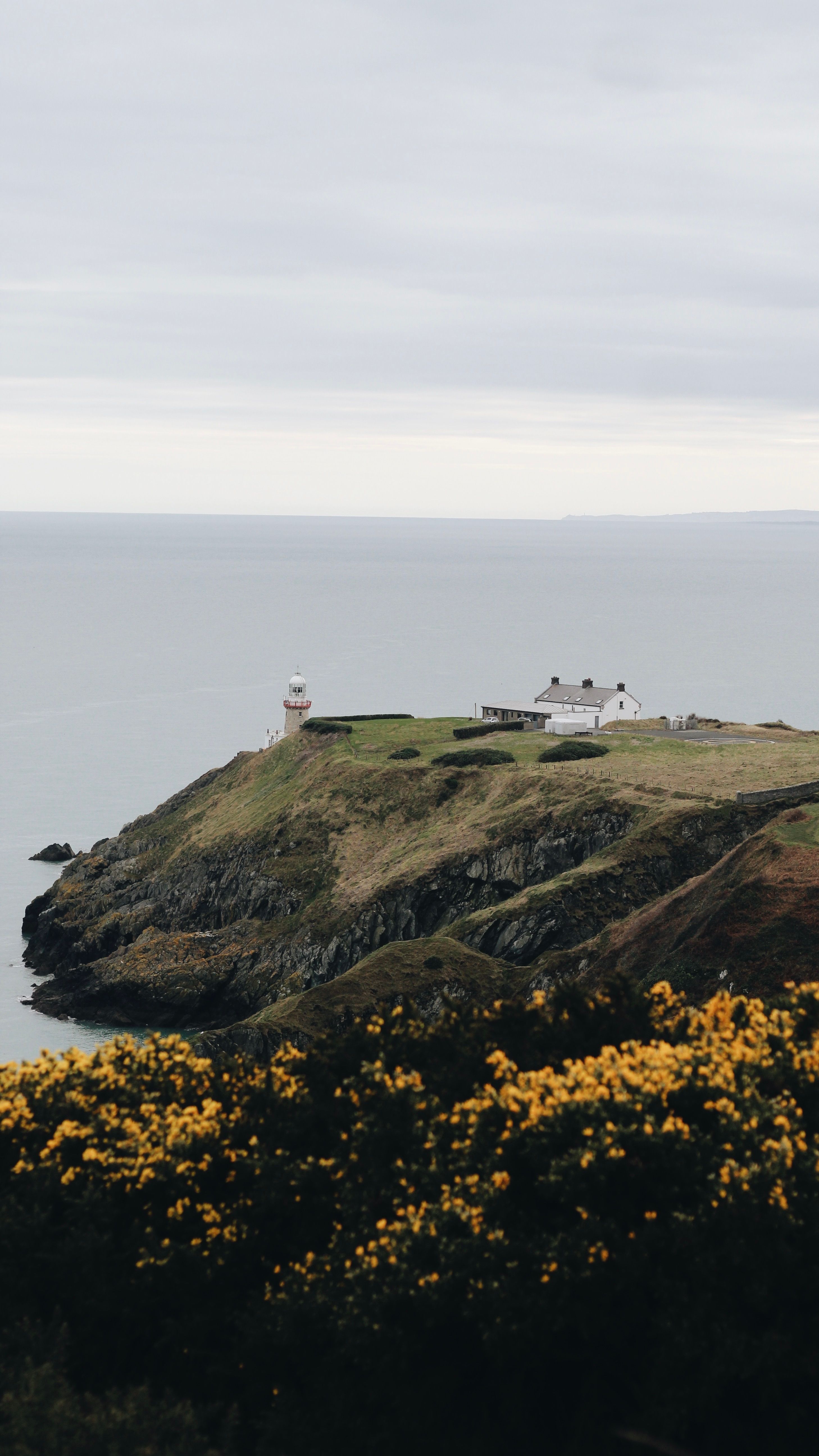 Scenic View of Lighthouse on Irish Cliff · Free Stock Photo
