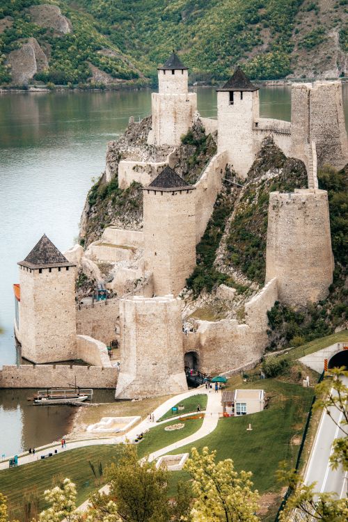 Free Captivating aerial shot of the ancient Golubac Fortress by the Danube River in Serbia, showcasing medieval architecture. Stock Photo
