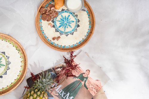 Free An elegant flat lay with decorative baskets, cookies, milk, and a magazine. Perfect for lifestyle themes. Stock Photo