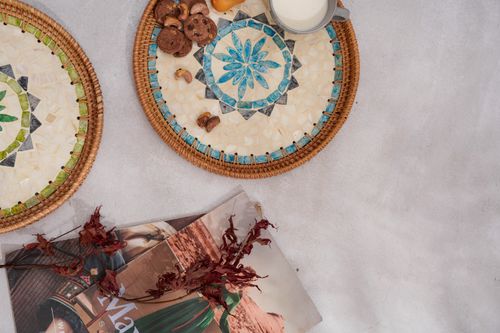 Free Artistic flat lay showcasing decorative mosaics, rustic elements, and a stylish magazine layout. Stock Photo