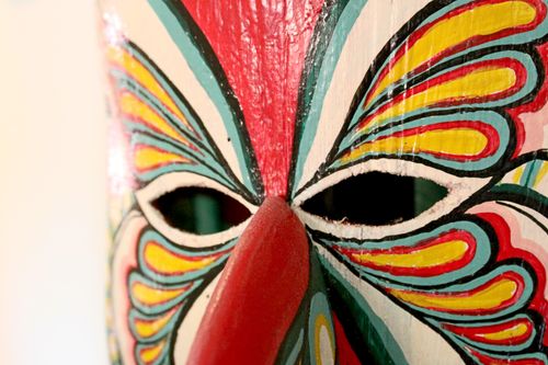 Free Vibrant handcrafted mask featuring detailed colorful patterns and creative artistic design. Stock Photo