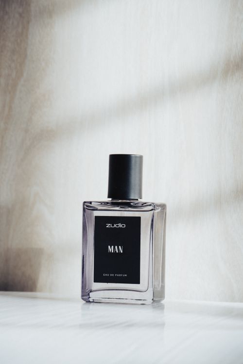 Free Close-up of a luxury perfume bottle in soft natural light. Stock Photo