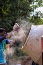 Ethnic man preparing cement for construction