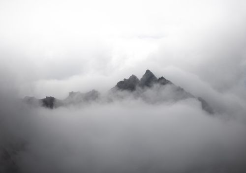 Free Stunning view of misty mountain peaks shrouded in clouds, captured in Obergurgl, Austria. Stock Photo