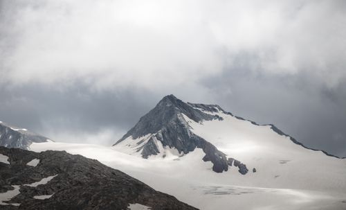 Free A stunning view of a snowy mountain peak under cloudy skies in Obergurgl, Tirol, Austria. Stock Photo
