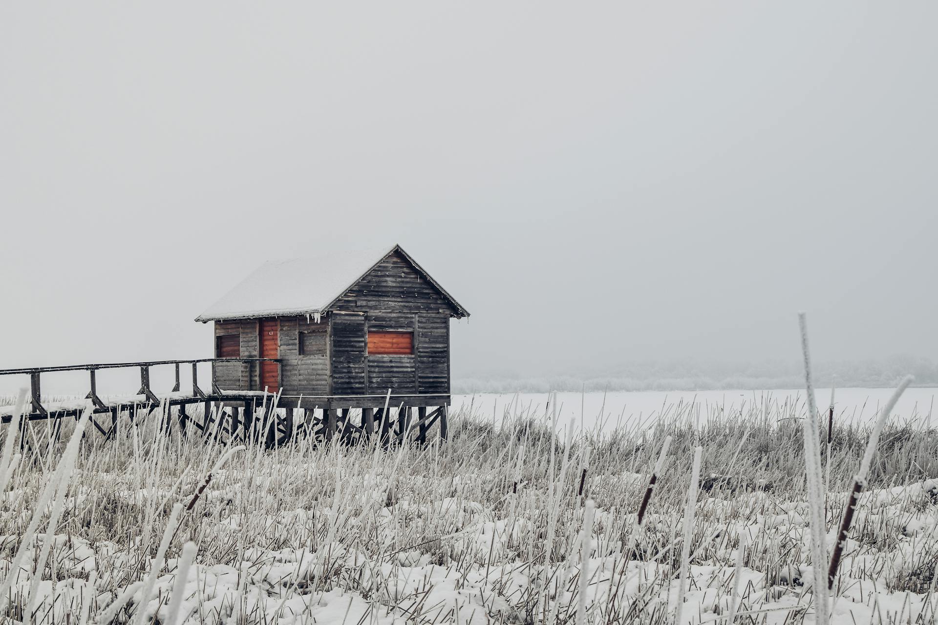 Barn on Field Against Clear Sky during Winter