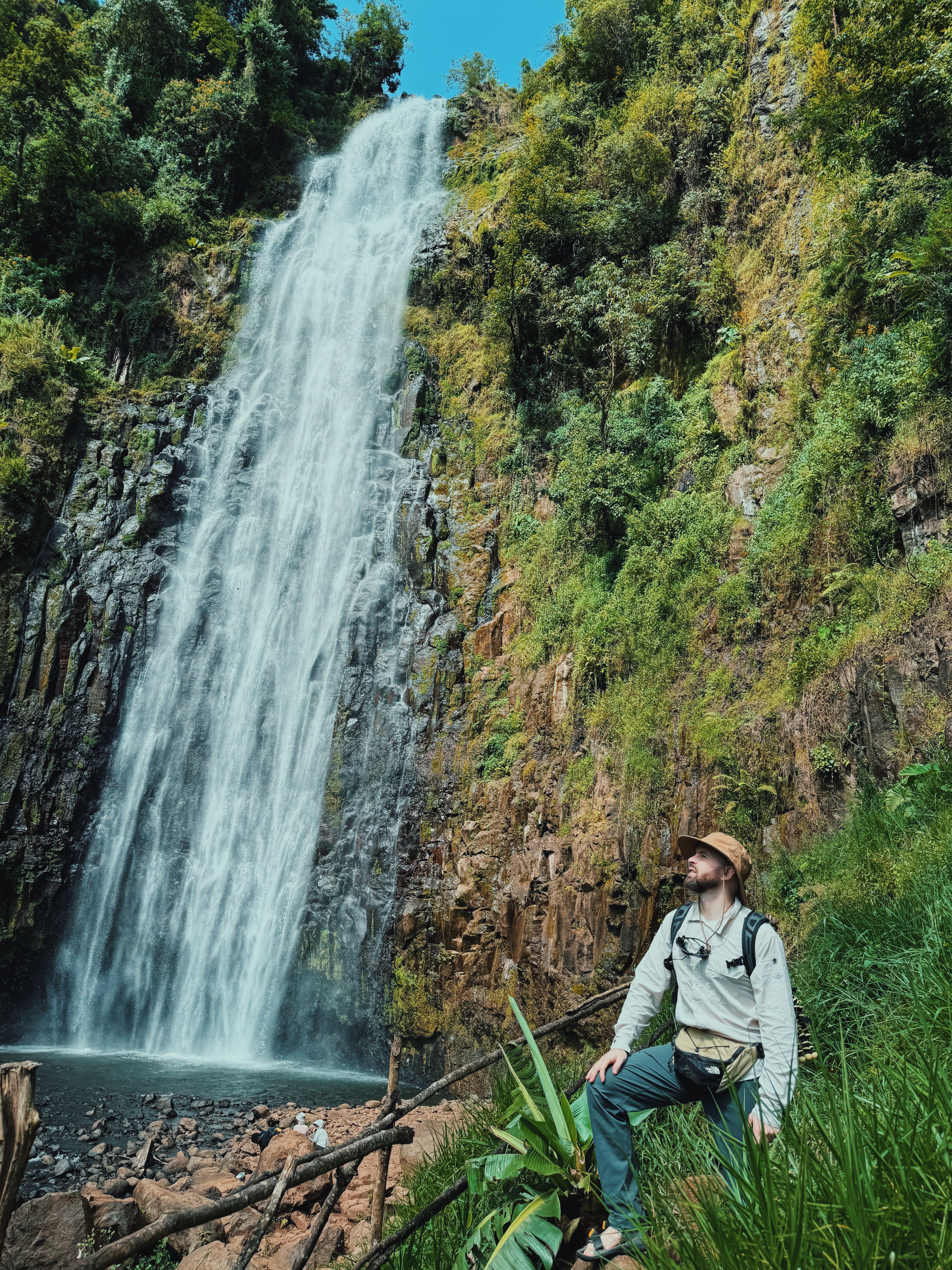 Adventurous hiker at majestic waterfall scene, Kenya