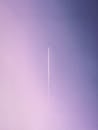 Airplane Contrail in Pink and Purple Sky