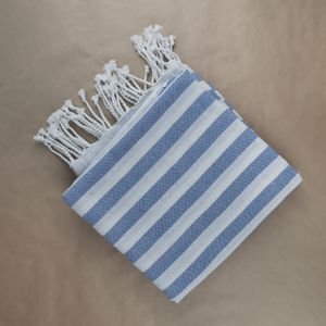 Folded blue and white striped cotton towel — photo by Karen Laårk Boshoff on Pexels
