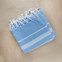 Cornflower throw with knotted fringe — photo by Karen Laårk Boshoff on Pexels