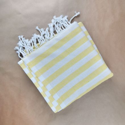Folded striped cotton kitchen towel — photo by Karen Laårk Boshoff on Pexels