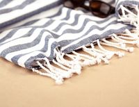 Knotted fringe detail on a slate stripe throw — photo by Karen Laårk Boshoff on Pexels