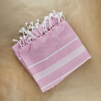 Rosehip stripe throw folded flat — photo by Karen Laårk Boshoff on Pexels