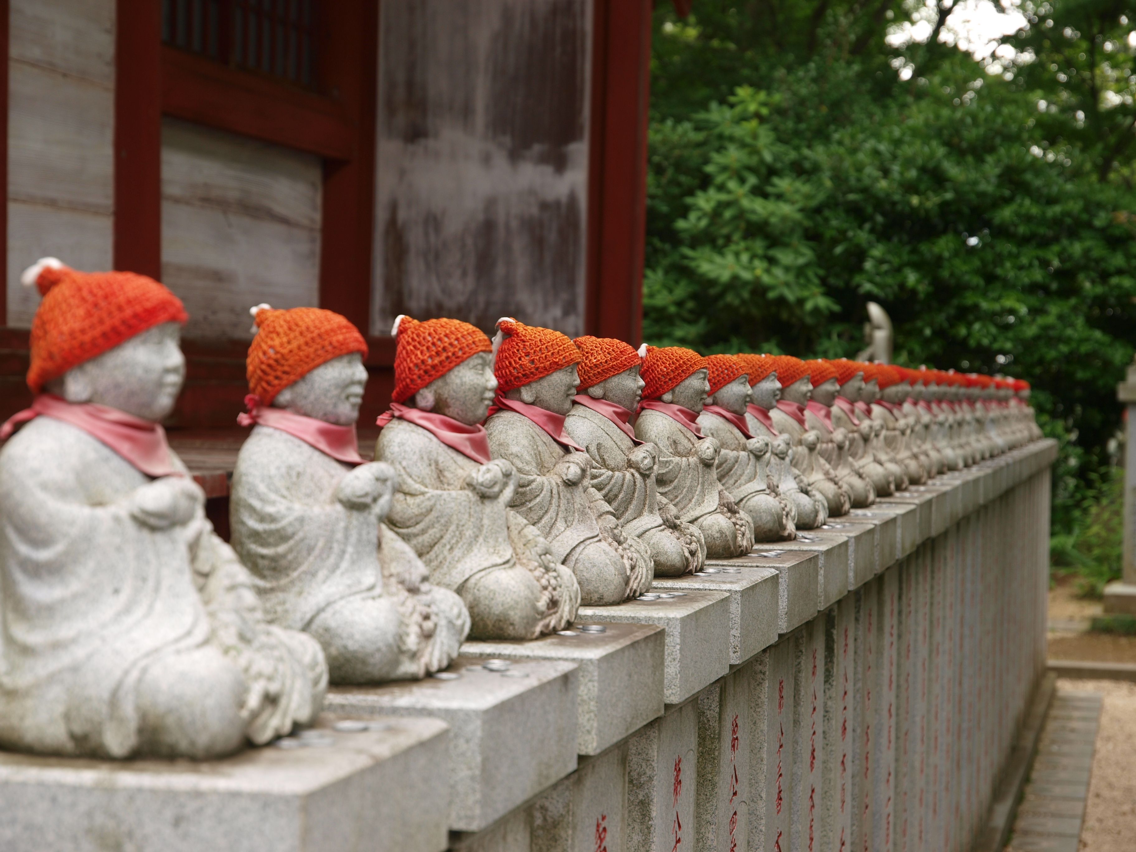 Row of Jizo Statues with Knitted Hats at Japanese Shrine · Free