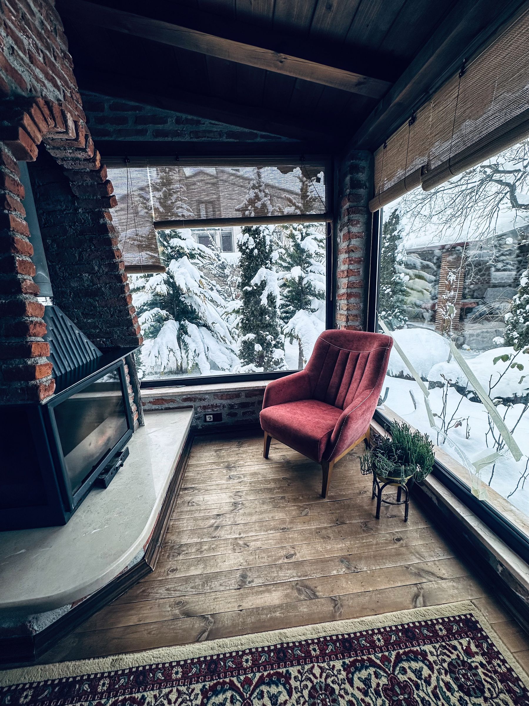 Fireplace with a visible snow-covered exterior
