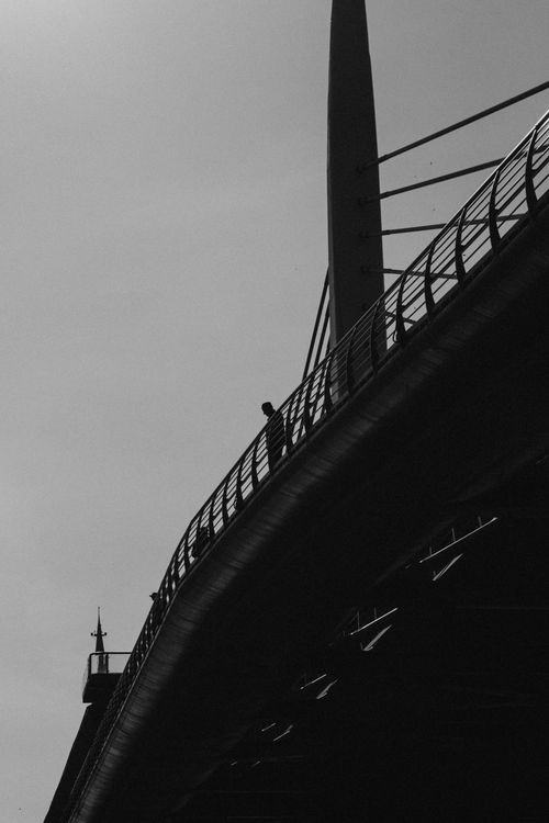 Free A striking silhouette of a person on a modern bridge in İstanbul. Stock Photo
