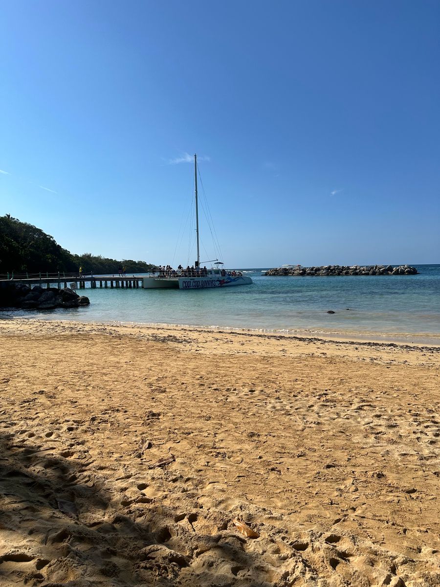 Calm beach and sailboat in Ocho Rios, Jamaica
