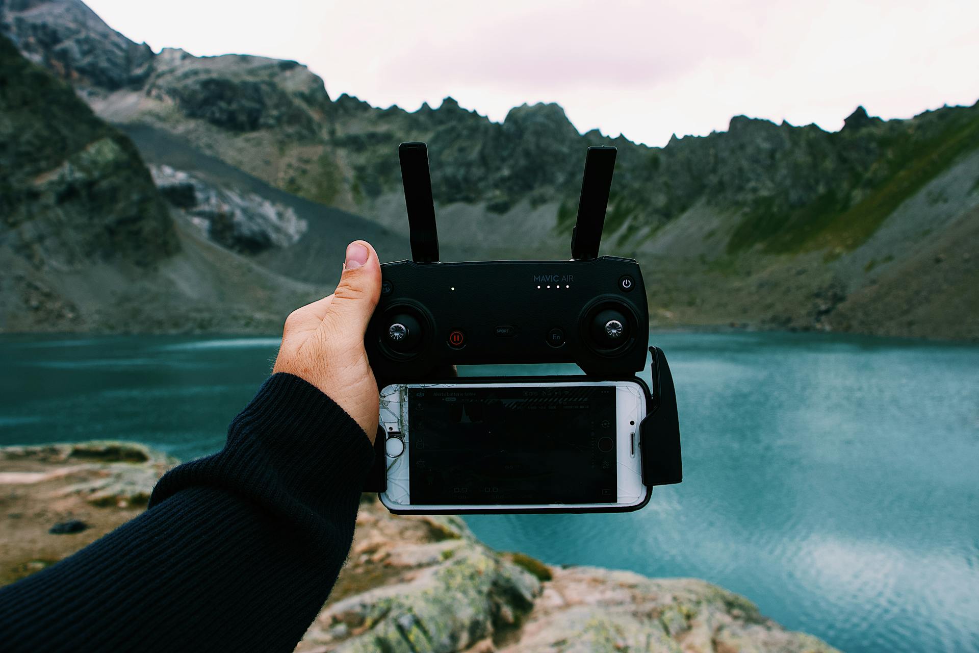 Photo of Person Holding Remote Control