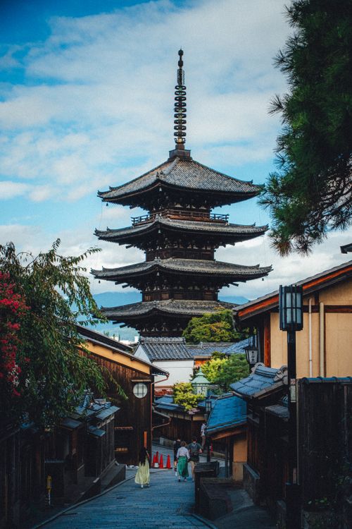 Free Historic Yasaka Pagoda in Kyoto against a beautiful sky, surrounded by traditional wooden buildings. Stock Photo