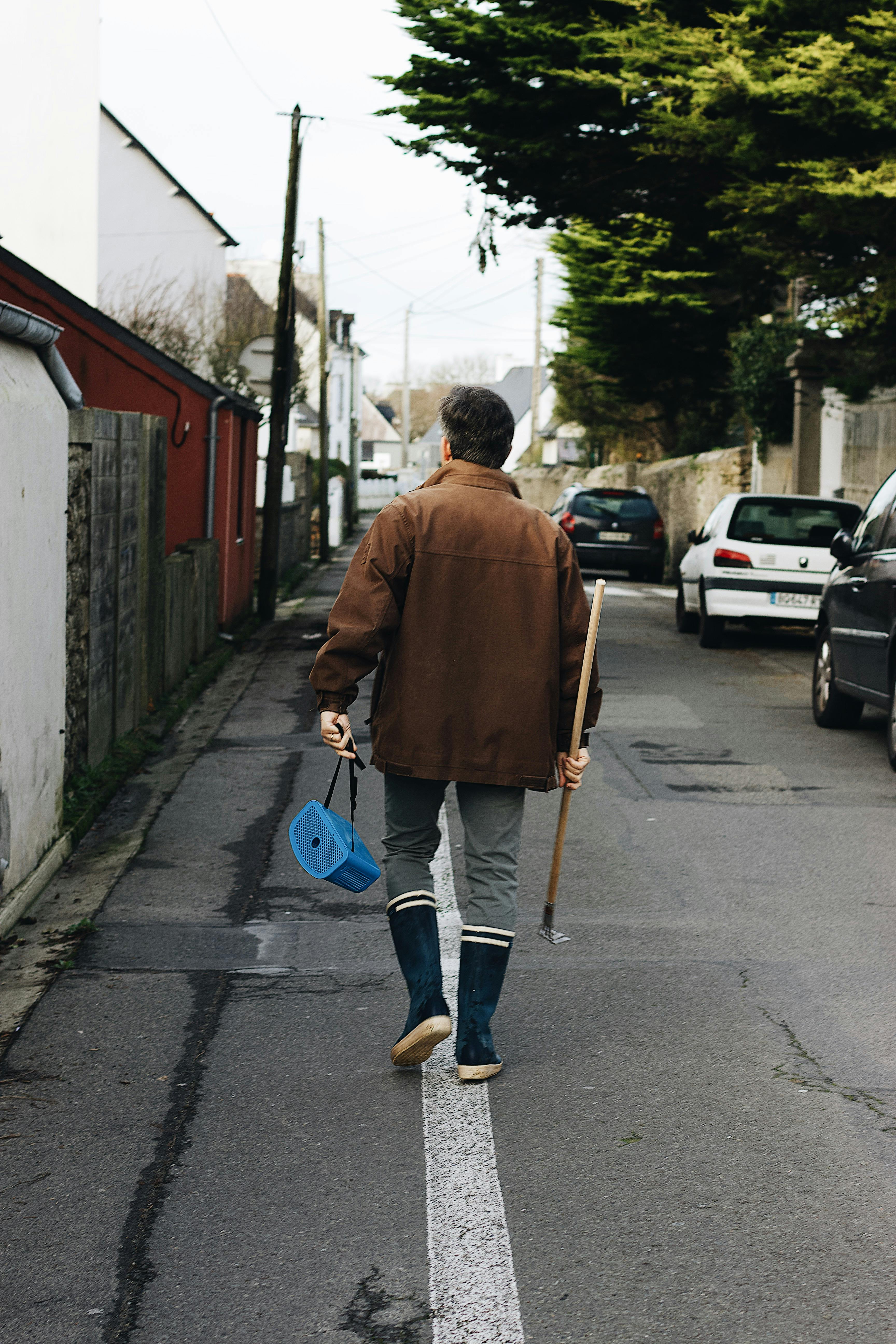 Photo of Person Walking on Street