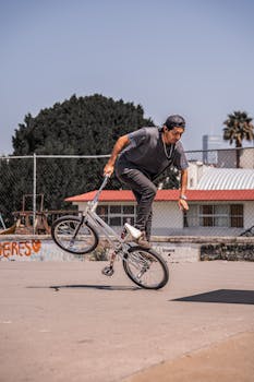 A cyclist performs a BMX trick on a sunny day in Puebla, Mexico.