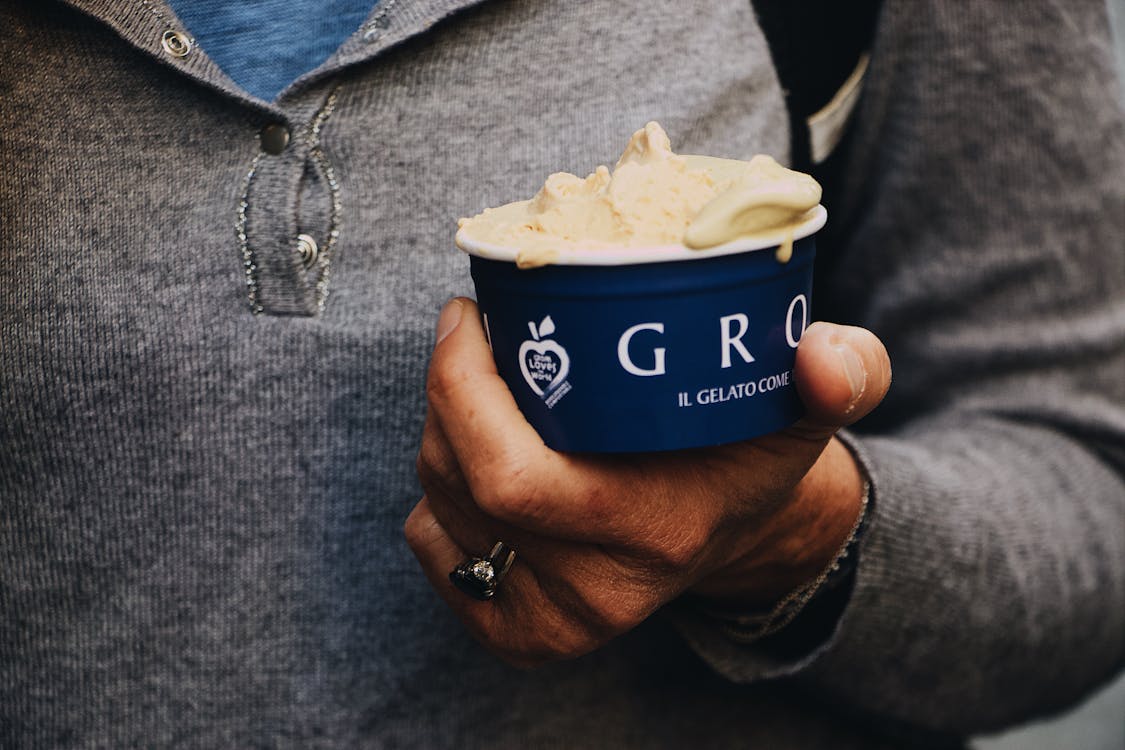 Person Holding Ice Cream Cup