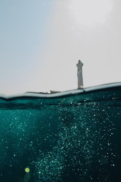 Low Angle Shot Of A Light House From Sea Surface